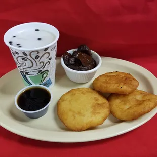 a plate of food and a cup of coffee