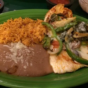 The pollo adobe - tender chicken, tasty cheese sauce, and a nice mix of healthy veggies. Sides of refried beans and rice. Great value!