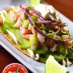 a plate of food with shrimp and avocado