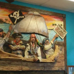 a mural of pirates in a restaurant