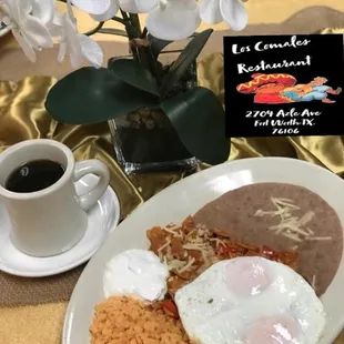 a plate of food and a cup of coffee