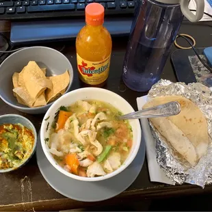 Sopa de Pollo. Guacamole, chips and flour tortillas. Valentina sauce.