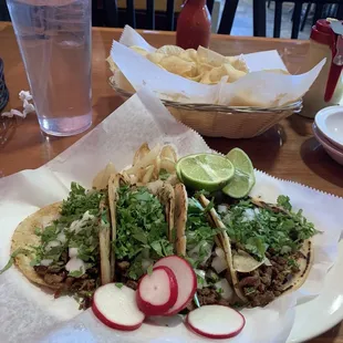 a plate of tacos and chips