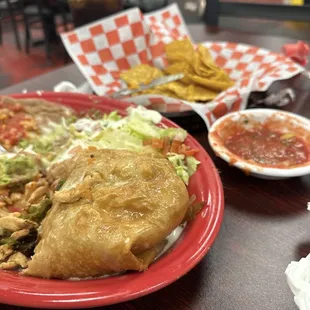 Part of the chimichanga, chips and salsa. His guacamole is long gone, it was so good!
