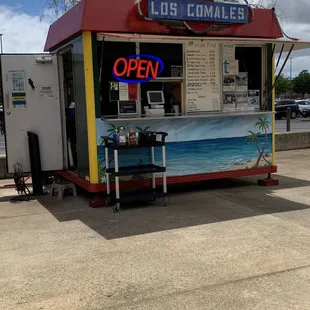 a food truck with a sign that says open