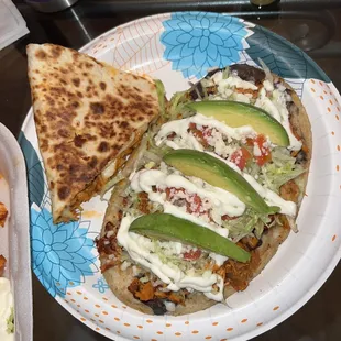 Besutiful presentation of the huarache along side part of my chicken quesadillas. I ate huarache toppings with my quesadilla slice. Yum!