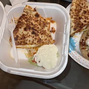 Part of my quesadillas. The other slice is in the next photo. Delicious.  Yum yum!