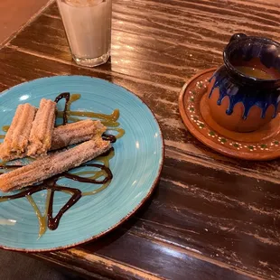 a plate of bananas and chocolate sauce