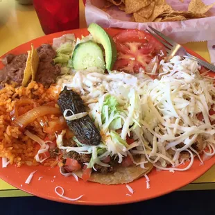 Amazing dinner special: chicken enchiladas Verde, tamale, and beef taco