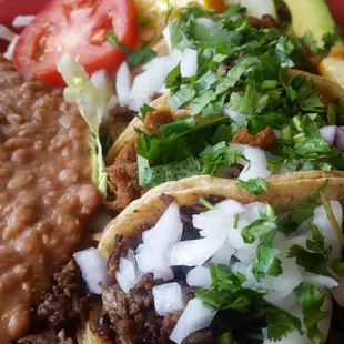 3 tacos combo with asada, lengua, and tripa on corn