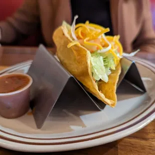 a plate with a taco on it