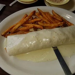 My steak burrito  with fries