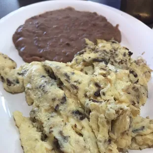 &quot;Machacado and Egg&quot; Plate with a side of refried beans.