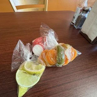 Condiments: Limes, Raddish, Pickled Carrots and Jalapeños