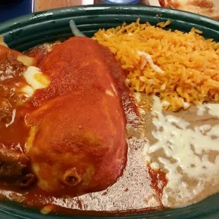 a plate of enchiladas and rice