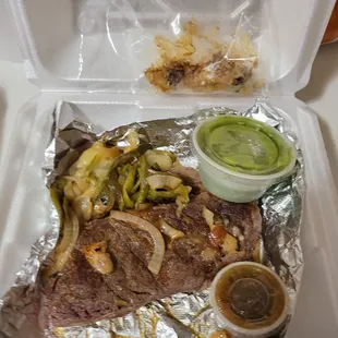 a meal in a styrofoam container