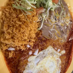 Red Chile cheese enchiladas with medium cook egg !