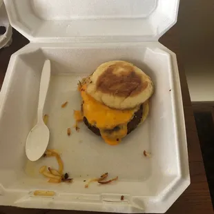 Sausage egg and cheese on English muffin that comes with "eaten" hash browns