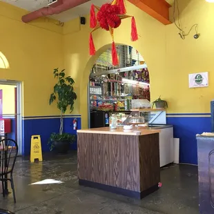 There is a Mexican grocery store to the left of the entrance to the restaurant