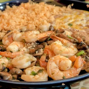 Shrimp with garlic paired with rice and beans