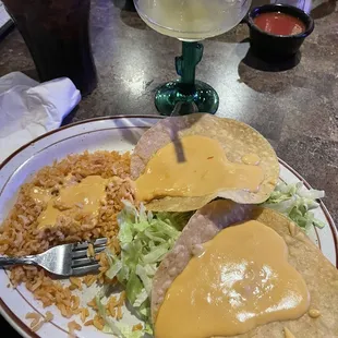 Corn tostada with cheese dip, side of rice, frozen mango margarita