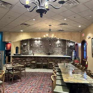 a dining area with tables and chairs