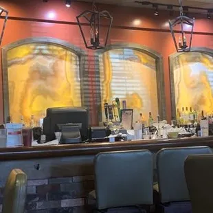 Zoom to see all the dirty glasses on the bar.