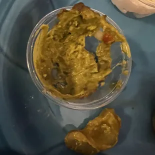 Sliced pickle in my guacamole