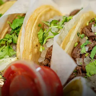 three tacos in a basket
