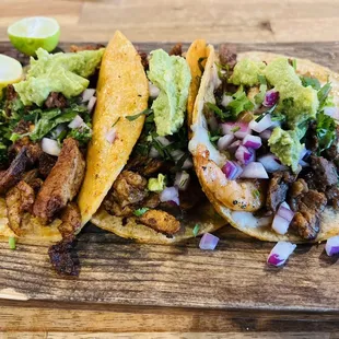 Delicious adobada &amp; surf &amp; turf tacos at Los Cuates Seafood &amp; Bar in Chula Vista, CA. The presentation could be better.