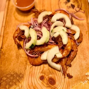 a wooden cutting board with a sandwich on it