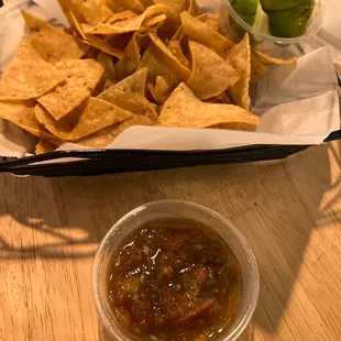 a basket of chips and salsa