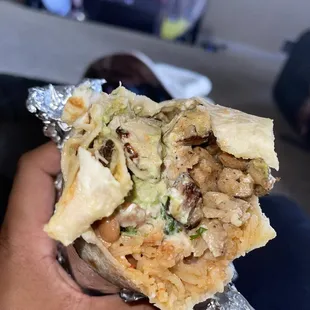 Super Pollo burrito with everything on it .!
