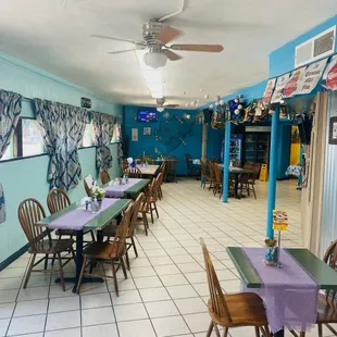 a restaurant with tables and chairs