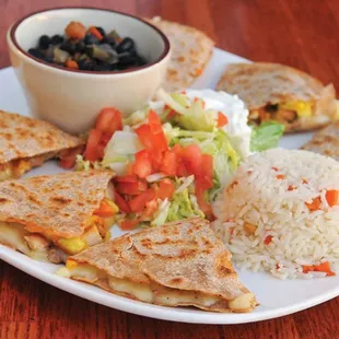 a plate of quesadillas and rice