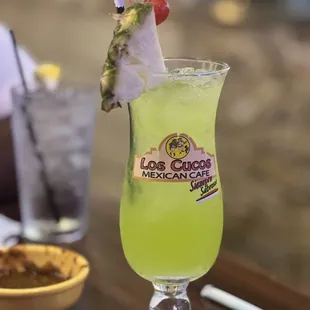 a glass of lime margarita