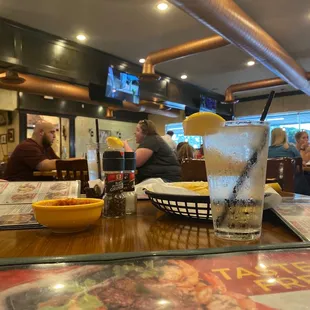 a glass of water with a slice of lemon