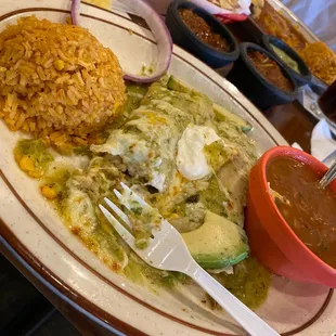 Enchiladas verdes with a plastic fork because of covid