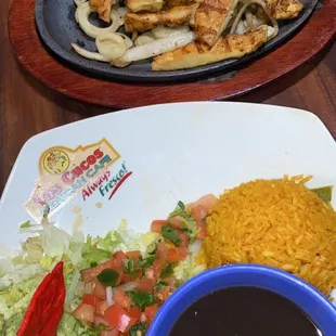 Chicken fajitas for 1, black beans, rice, guacamole &amp; pico de gallo.