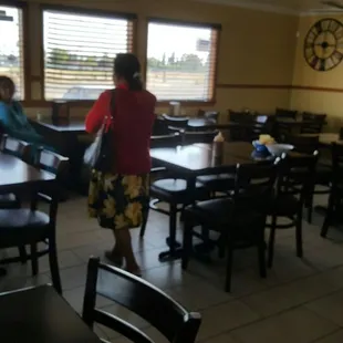 Cute small dining. Or Cozy. Or nice with its TV hanging high on wall