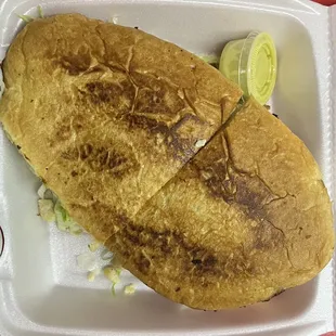 a sandwich in a styrofoam container