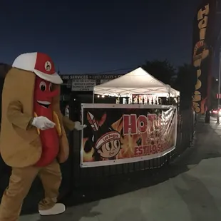 a man dressed as a hot dog
