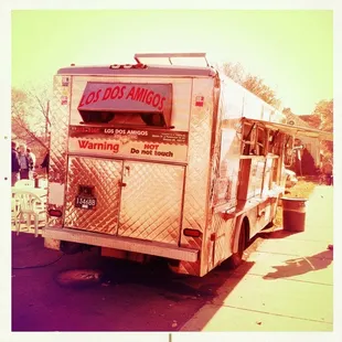 a food truck parked on the side of the road