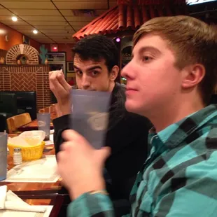 two men sitting at a table