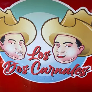 two men wearing hats