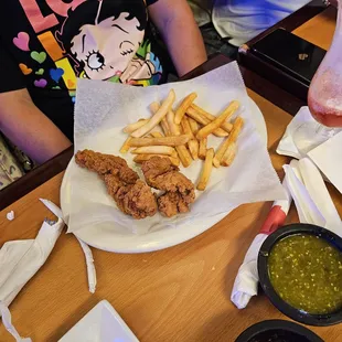 a person sitting at a table with food