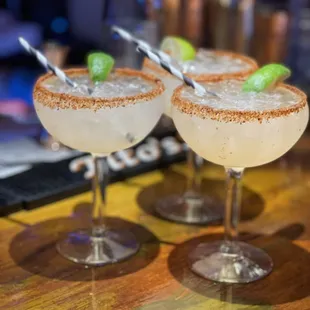 two margaritas on a bar