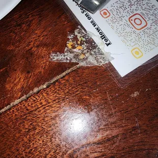 Plastic on my husband's fried fish plate in the rice.