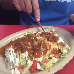 Burrito with salad and salsa on top