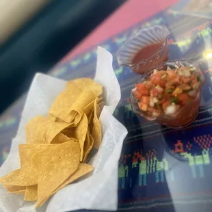 a tortilla and a bowl of salsa